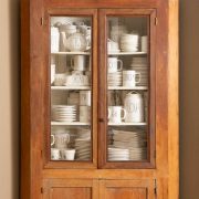 shelf containing rae dunn pottery