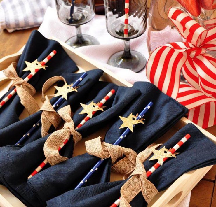 A set of five Fourth of July striped party straws with a small star decal on each one