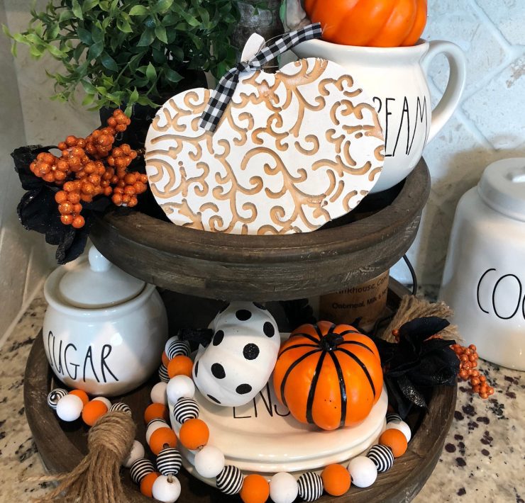 This rustic wood, circular, two-tiered tray stand is perfect for farmhouse Halloween parties.