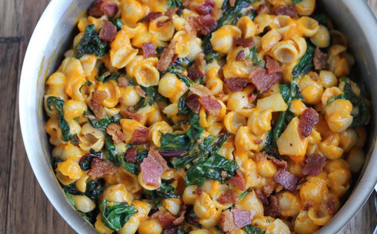 The cheesiest of all Thanksgiving recipes, this macaroni and cheese is mixed with bacon, spinach and pumpkin.