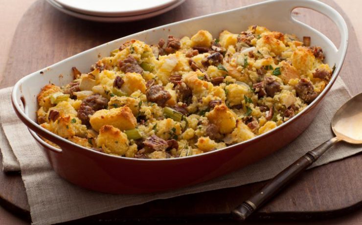 This Thanksgiving recipe shows cornbread stuffing with sausage, chopped pecans and apple chucks mixed in.