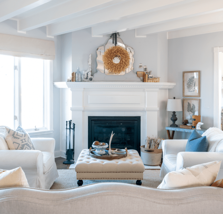 Modern farmhouse living with white walls and fireplace, a look that has been deep cleaned.