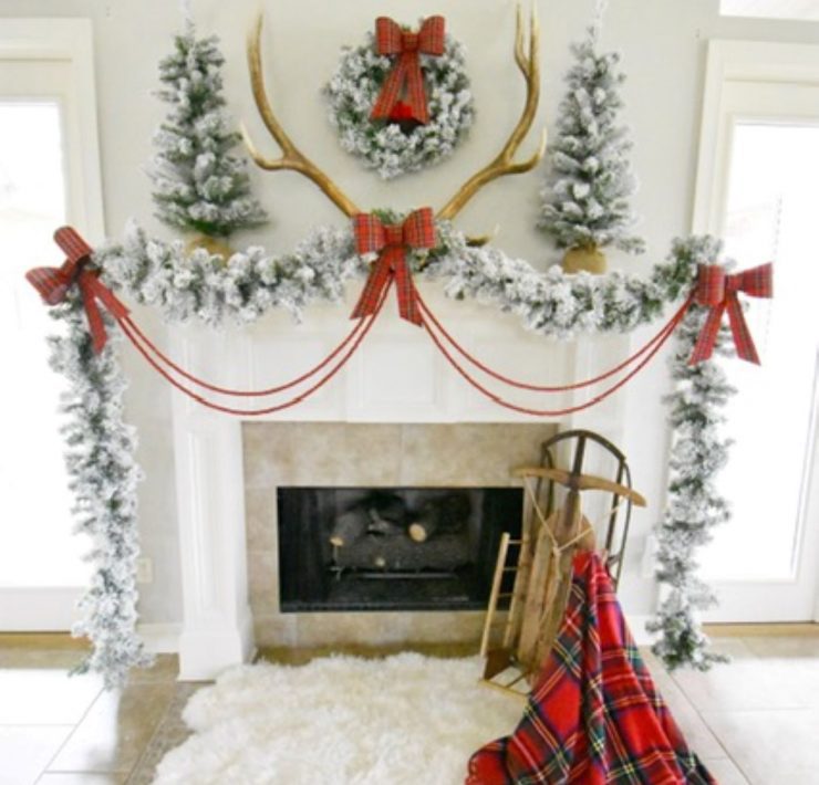 Red ribbons and bows complete the Christmas mantelpiece