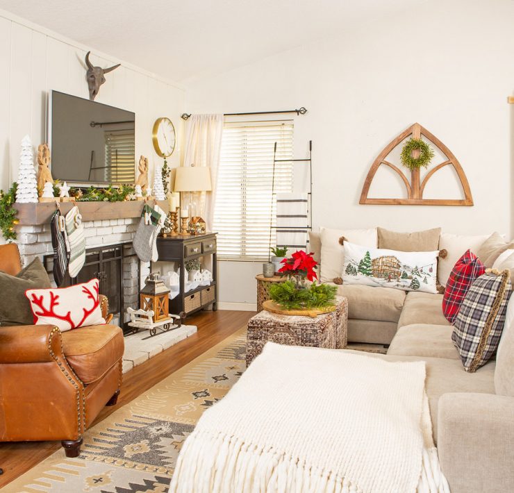 Christmas cabin family room with neutral furniture and decor.