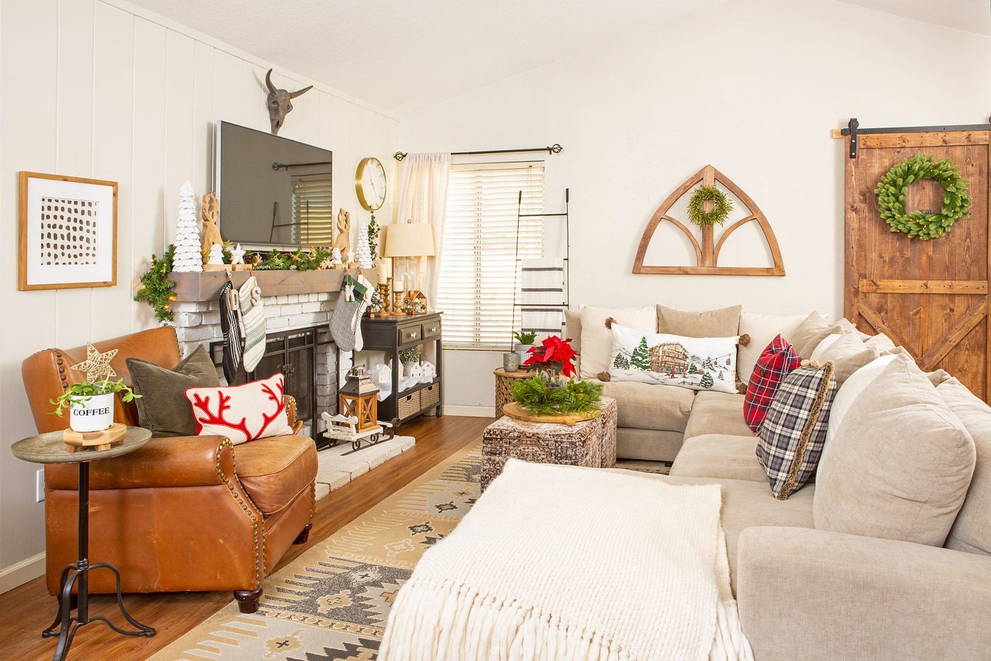 Christmas cabin family room with neutral furniture and decor.