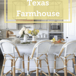 The exterior of this Texas farmhouse has a broad triangular archway over a table ready for guests!