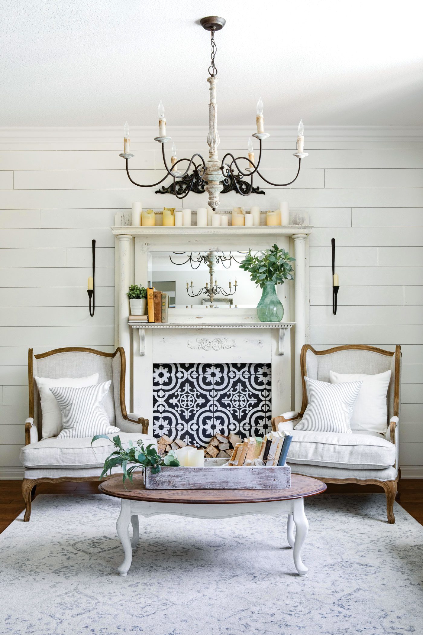 A classic white mantelpiece. Instead of a fire, the mantel sports a blue and white tiling with a unique pattern