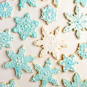 Iced sugar cookies in delicate baby blue and white frosting swirls