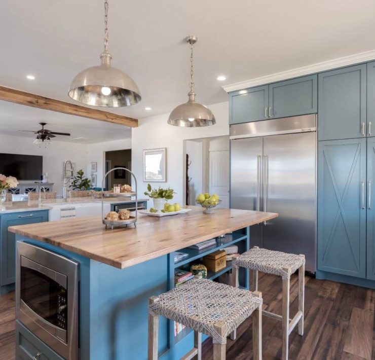 Farmhouse-style paneling in the kitchen island and in the large cabinets