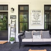 Farmhouse Georgia porch with sofa and sign art