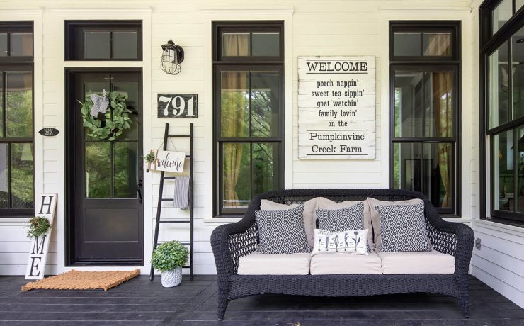Farmhouse Georgia porch with sofa and sign art