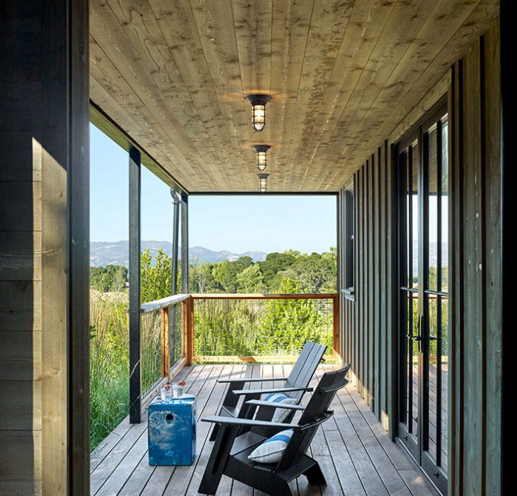 Outdoor patio with industrial lighting and outdoor seating area