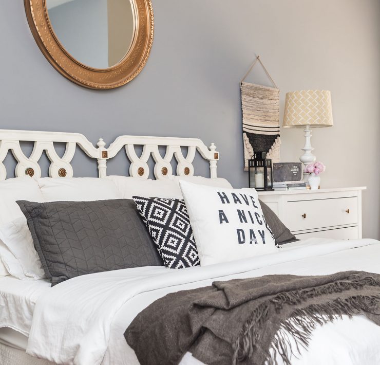 Gray bedroom with white bed