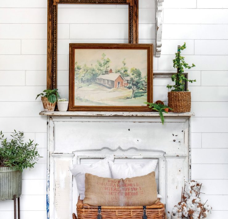 Vintage art on an antique salvage faux fireplace mantle top