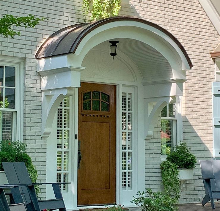 Front door New England home with curved portico