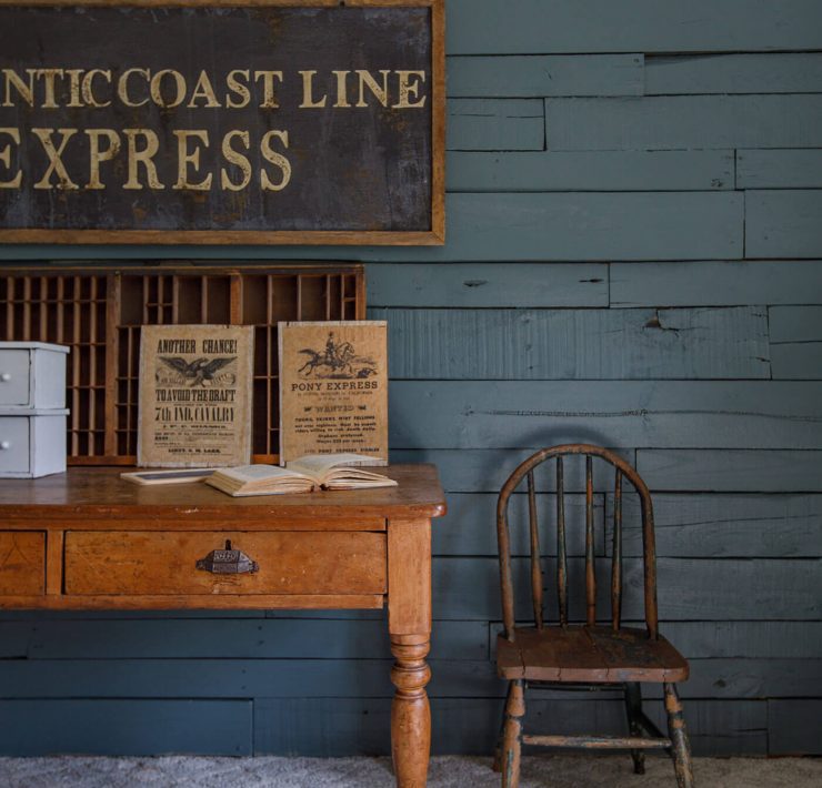 Dark vintage room with old furniture and Express vintage sign for collecting vintage signs