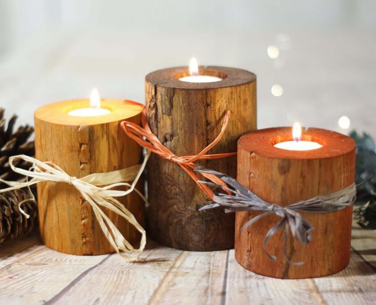 Rustic wood candle holders with candles inside