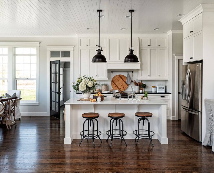 Modern farmhouse kitchen with wood and steel barstools