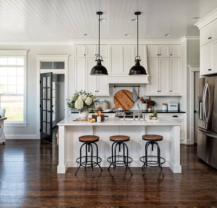 Modern farmhouse kitchen with wood and steel barstools