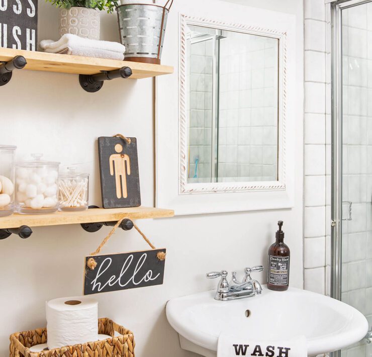 Bathroom with open shelves and pedestal sink