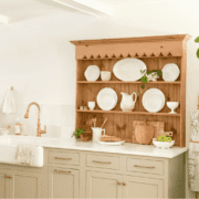 kitchen with new cabinets and antique hutch top on countertop to go vintage