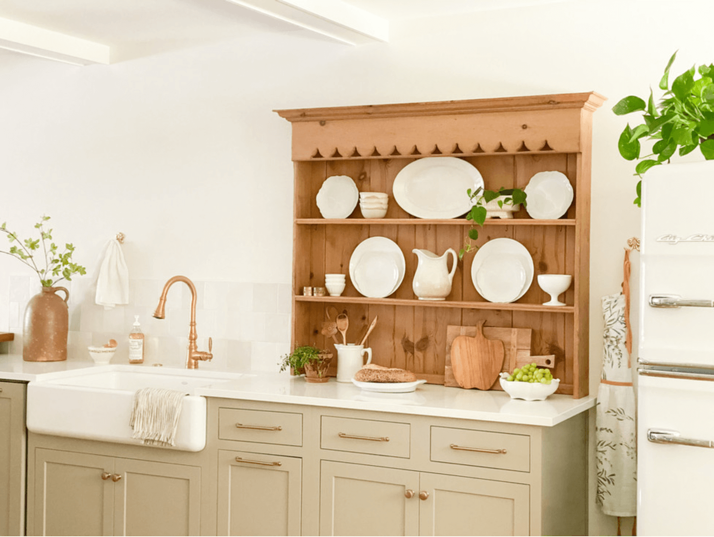 kitchen with new cabinets and antique hutch top on countertop to go vintage