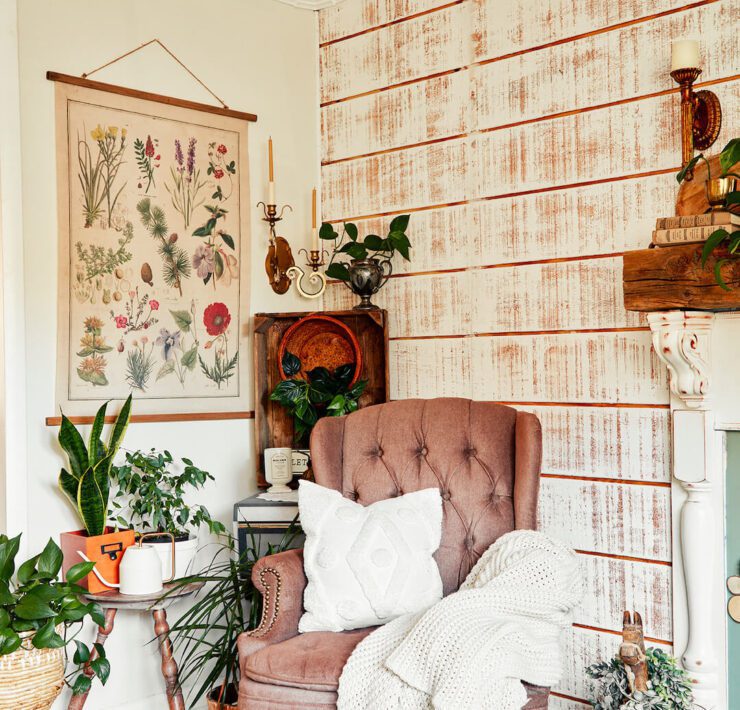 living room with tufted wingback chair and botanical print