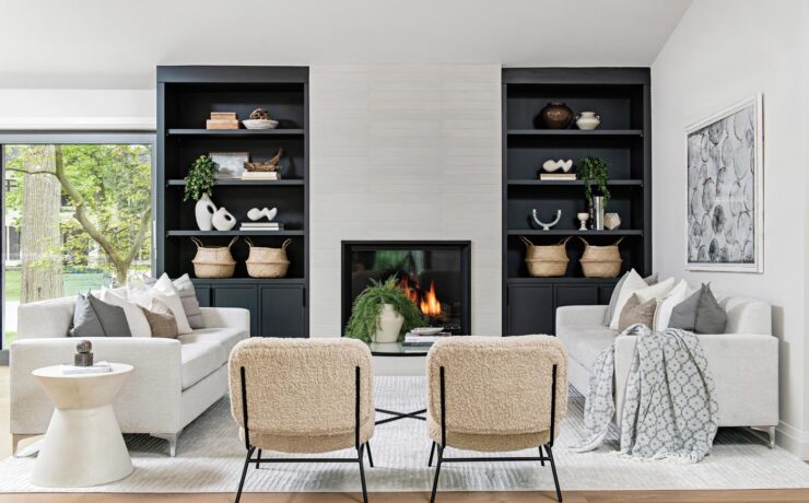 living room with built in shelves, fireplace and white couches